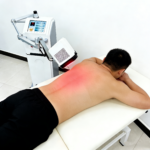 Class 4 Laser Machine – Sciatica & Back Pain Relief Class 4 Laser Machine treating sciatica and back pain on patient's back Pakistan