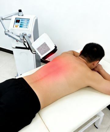 Class 4 Laser Machine treating sciatica and back pain on patient's back Pakistan
