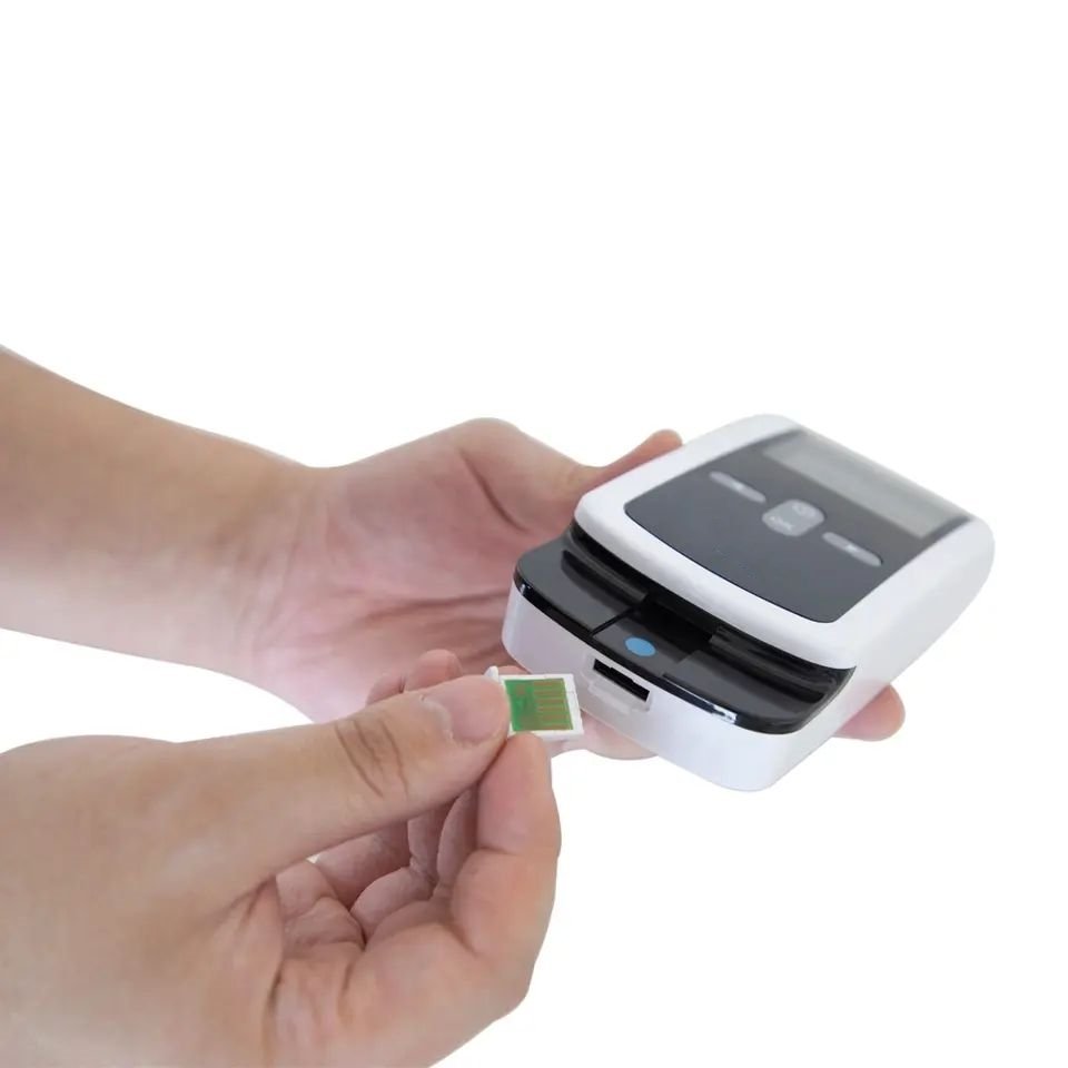 PT/INR Coagulation Analyzer – Home Use Pakistan Inserting calibration code chip into PT INR Coagulation Analyzer Pakistan